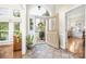 Inviting foyer with decorative door, tile flooring, and ample natural light at 3866 Bethany Nw Ct, Concord, NC 28027