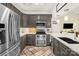 Modern kitchen with stainless steel appliances, stone countertops, and stylish backsplash at 3866 Bethany Nw Ct, Concord, NC 28027
