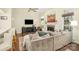 Cozy living room with vaulted ceiling, fireplace, large sectional, and hardwood floors at 3866 Bethany Nw Ct, Concord, NC 28027