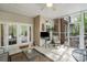 Charming screened-in porch with tiled floors and outdoor seating with a ceiling fan at 3866 Bethany Nw Ct, Concord, NC 28027