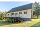 View of back exterior featuring a deck with metal railings and stair access to the backyard at 3921 Bon Rea Dr, Charlotte, NC 28226