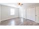 This cozy bedroom has two large, double-door closets and a ceiling fan at 3921 Bon Rea Dr, Charlotte, NC 28226