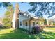 This charming two-story home has a stone chimney and a covered porch at 3921 Bon Rea Dr, Charlotte, NC 28226