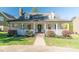 Charming home featuring a welcoming front porch, dormer windows, and manicured landscaping at 3921 Bon Rea Dr, Charlotte, NC 28226