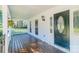 Inviting front porch with wooden flooring, decorative door, and ample natural light at 3921 Bon Rea Dr, Charlotte, NC 28226