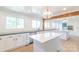 Modern kitchen with white cabinetry, subway tile backsplash, island, and stainless steel appliances at 3921 Bon Rea Dr, Charlotte, NC 28226