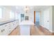 Well-lit kitchen featuring a large island, stainless appliances, and wood floors at 3921 Bon Rea Dr, Charlotte, NC 28226