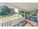 Inviting porch view with charming white railings and colorful flower baskets creating a welcoming atmosphere at 3921 Bon Rea Dr, Charlotte, NC 28226
