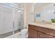 Bathroom featuring tile shower, granite vanity, tile floors, and modern fixtures at 400 Eden Hollow Ln, Weddington, NC 28104