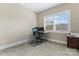 Bright bedroom features a computer setup, natural light, and neutral wall and carpet colors at 400 Eden Hollow Ln, Weddington, NC 28104
