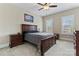 Primary bedroom with ceiling fan and natural light from window with wooden shutters at 400 Eden Hollow Ln, Weddington, NC 28104