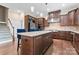 Gourmet kitchen featuring a large center island, stainless appliances, and rich wood cabinetry at 400 Eden Hollow Ln, Weddington, NC 28104