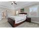 Spacious main bedroom with ceiling fan, plantation shutters, and neutral paint at 400 Eden Hollow Ln, Weddington, NC 28104