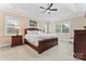 Serene main bedroom with tray ceiling, plantation shutters, carpet flooring, and wood furniture at 400 Eden Hollow Ln, Weddington, NC 28104