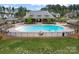 Beautiful community pool area with lounge chairs, tables, and a covered pavilion at 400 Eden Hollow Ln, Weddington, NC 28104