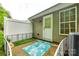 Cozy back patio with astroturf, stylish outdoor rug, and privacy fence at 413 Lexie Ln # 92, Rock Hill, SC 29732