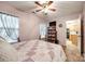 Comfortable pink bedroom with plush carpet, soft bedding, and kitchen access via an open doorway at 413 Lexie Ln # 92, Rock Hill, SC 29732