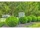 Community sign for 'Olde Towne,' surrounded by manicured bushes and lush green trees at 413 Lexie Ln # 92, Rock Hill, SC 29732
