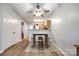 Bright dining area with modern furnishings, wood floors, and views to the kitchen at 413 Lexie Ln # 92, Rock Hill, SC 29732