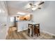 Open-concept dining area with views to the kitchen, stainless steel refrigerator, and a bright atmosphere at 413 Lexie Ln # 92, Rock Hill, SC 29732