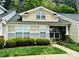 Inviting townhome featuring traditional architecture, well-manicured landscaping, and charming front porch at 413 Lexie Ln # 92, Rock Hill, SC 29732