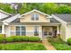 Charming townhouse with well-manicured landscaping, inviting front porch, and classic architectural details at 413 Lexie Ln # 92, Rock Hill, SC 29732