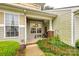 Inviting front porch features brick accents, a welcome sign, and space for seating, creating a cozy entry at 413 Lexie Ln # 92, Rock Hill, SC 29732