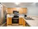 Well-equipped kitchen features stainless steel appliances, ample wood cabinets, and efficient layout at 413 Lexie Ln # 92, Rock Hill, SC 29732