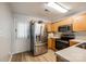 Bright kitchen featuring stainless steel appliances, wood cabinets, and a light-filled breakfast nook at 413 Lexie Ln # 92, Rock Hill, SC 29732
