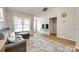 Comfortable living room with large windows, ample natural light, and a cozy seating area at 413 Lexie Ln # 92, Rock Hill, SC 29732