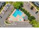 Aerial view of a bright blue community pool surrounded by parking spots and visitor parking at 413 Lexie Ln # 92, Rock Hill, SC 29732