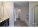 Bathroom featuring a tub and shower with a view into the walk-in closet at 4200 Long Arrow Dr, Concord, NC 28025