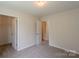 Bedroom featuring doorways to a closet and another room at 4200 Long Arrow Dr, Concord, NC 28025