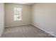 Bedroom featuring a large window providing natural light at 4200 Long Arrow Dr, Concord, NC 28025