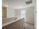 Upstairs hallway with carpet and railing leads to additional rooms at 4200 Long Arrow Dr, Concord, NC 28025