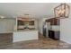 Bright kitchen with stainless steel appliances, granite counters, dark cabinets, and an island at 4200 Long Arrow Dr, Concord, NC 28025