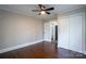 Bedroom showcasing hardwood floors, a ceiling fan, closet and a view to a nearby bathroom at 4429 Major St, Charlotte, NC 28208