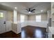 Bright dining room featuring paneled walls, hardwood floors, and a contemporary ceiling fan at 4429 Major St, Charlotte, NC 28208