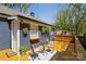 Outdoor living space featuring a wooden deck with seating and stylish potted plants at 4429 Major St, Charlotte, NC 28208