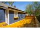 Picture of a blue house with a wooden deck and backyard fence at 4429 Major St, Charlotte, NC 28208