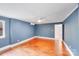 Bedroom featuring hardwood floors, ceiling fan, and a window for natural light at 4541 Bradbury Dr, Charlotte, NC 28209