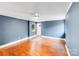 Bedroom with hardwood floors, a ceiling fan, and a window that brings in natural light at 4541 Bradbury Dr, Charlotte, NC 28209