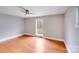 Spacious bedroom features a modern ceiling fan and hardwood floors at 4541 Bradbury Dr, Charlotte, NC 28209