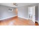 Bedroom leads into bathroom, showcasing an open layout and hardwood floors at 4541 Bradbury Dr, Charlotte, NC 28209