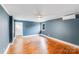 Comfortable bedroom features hardwood floors, a ceiling fan, and natural light at 4541 Bradbury Dr, Charlotte, NC 28209