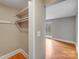 View of closet and entry into bedroom featuring hardwood floors at 4541 Bradbury Dr, Charlotte, NC 28209