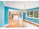 Charming dining room with beautiful hardwood floors and view into the modern kitchen at 4541 Bradbury Dr, Charlotte, NC 28209