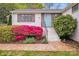 Charming home featuring a light blue front door, brick facade, and beautiful landscaping at 4541 Bradbury Dr, Charlotte, NC 28209