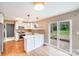 Bright kitchen with stainless steel appliances, a breakfast bar, and sliding doors to the backyard at 4541 Bradbury Dr, Charlotte, NC 28209