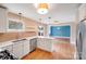 Beautiful modern kitchen with view into the dining and living areas, stainless appliances at 4541 Bradbury Dr, Charlotte, NC 28209